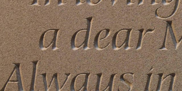 Close up of sandstone headstone