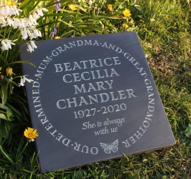 Slate Plaque laid in green grass and flowers